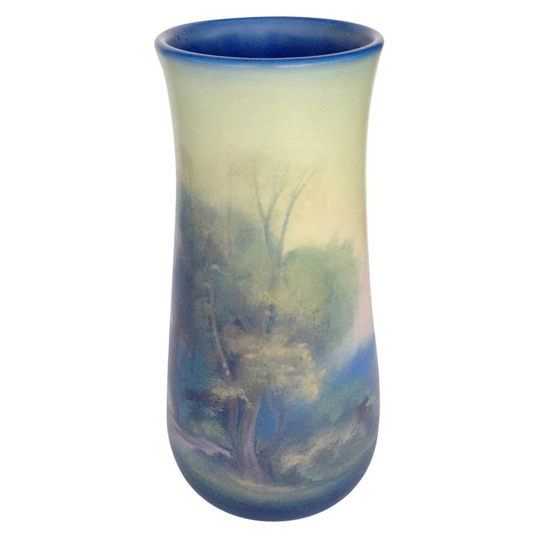 Rookwood Pottery Vellum Glaze Vase, circa 1925: This piece is an American Rookwood Pottery "Vellum" series ceramic vase by Lenore Asbury, circa 1925.A monumental landscape vase by Fred Rothenbusch for Rookwood depicting a series of trees set agains