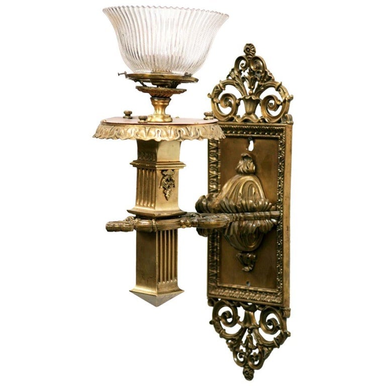 Bronze & Copper Edwardian era Torchiere Electric Wall Sconce, 2 Available: This solid bronze Edwardian torchiere wall sconce exudes timeless elegance with its classic silhouette and rich patina. The candle holder, styled like a Roman column, adds a dignified touch with its f