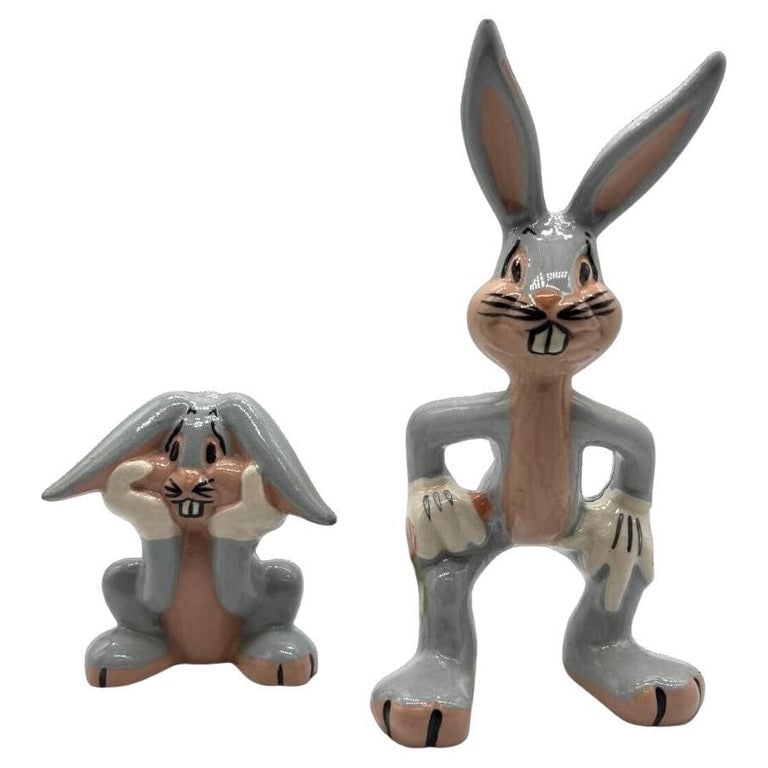 Vintage Looney Toons Bugs Bunny Porcelian Statue Pair Warner Bros by Evan Shaw: These two vintage ceramic figurines featuring Bugs Bunny, and capture the beloved character's playful personality. Crafted with detailed features and a charming retro design, they make a perfect addit