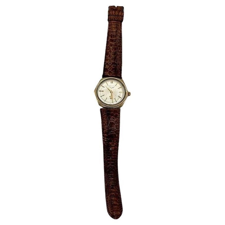 Longines 10K Gold-Filled Hexagonal Case Manual Watch w/ Crocodile Leather Band: This 1960s Longines 10K Gold-Filled hexagonal case watch showcases exceptional craftsmanship, highlighted by its elegant gold-filled case. This Swiss-made watch features a sub-seconds register and a r