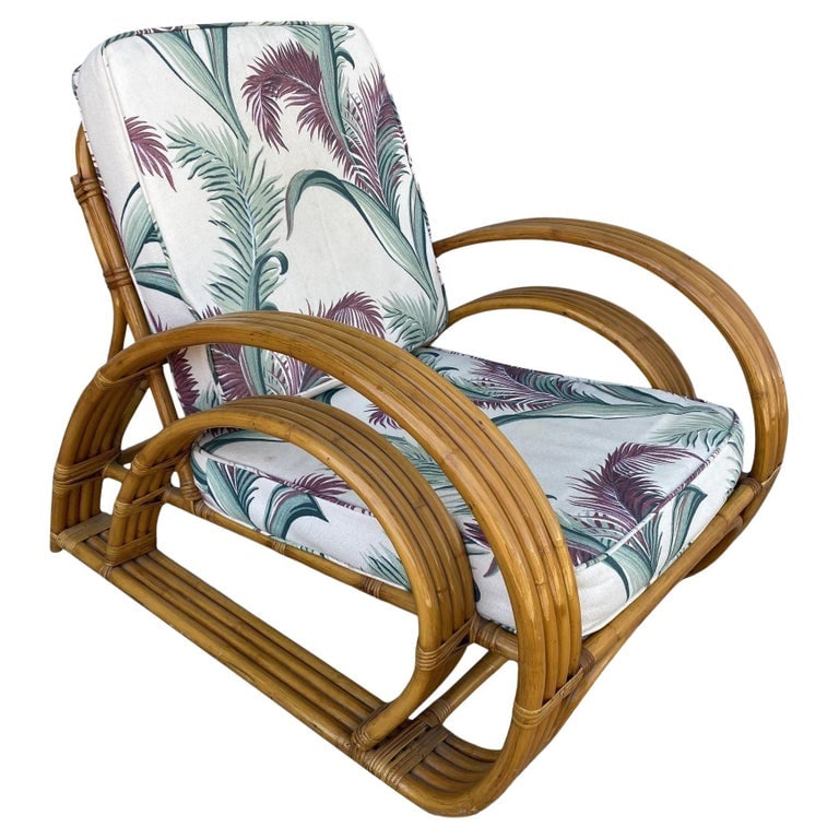 Restored Double Half Moon Rattan Four-Strand Lounge Chair: Rattan lounge, with what we at the shop call the "Half Moon", four-strand side arms in a double D configuration. Inspired by Paul Frankl this lounge is a midcentury chair featuring a great modernist l
