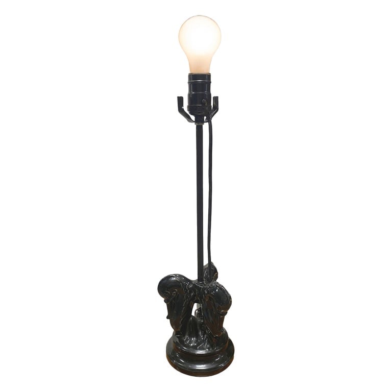 Mid Century Black Ceramic Swan Heads Table Lamp: Mid-century black glazed ceramic table lamp featuring elegant twin swan head figures, sculpted with graceful curves and a glossy finish. This striking piece blends sculptural form with functional desi