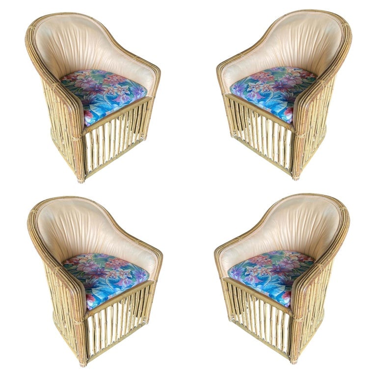 Set of Four Pencil Reed Rattan Armchair, Restored, 1970s: This beautifully restored set of four Pencil Reed Rattan spindle barrel armchairs, each featuring a padded seat and backrest. The set is meticulously refinished to highlight the natural rattan’s war