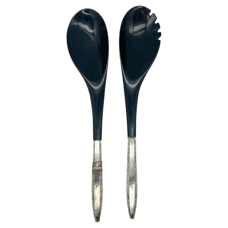 Modernist Sterling Salad Servers by Wallace Silver: Mid-cetury sterling silver salad servers with black nylon ends. The set is by Wallace Silver in the Washington pattern.There is a slight blemish on the Spoon handle on the front handle as pictured. ha