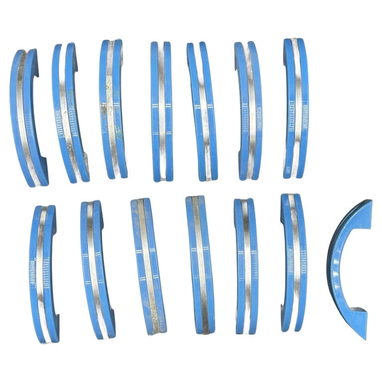 Art Deco Blue Bakelite Drawer Pulls w/ Chrome Strip, Set of 14: Set of 14, Never Used, Blue bakelite drawer/door pull knobs each with a chrome strip down the center. Complete your period kitchen cabinetry with this classic Art Deco-era piece with a striking red co