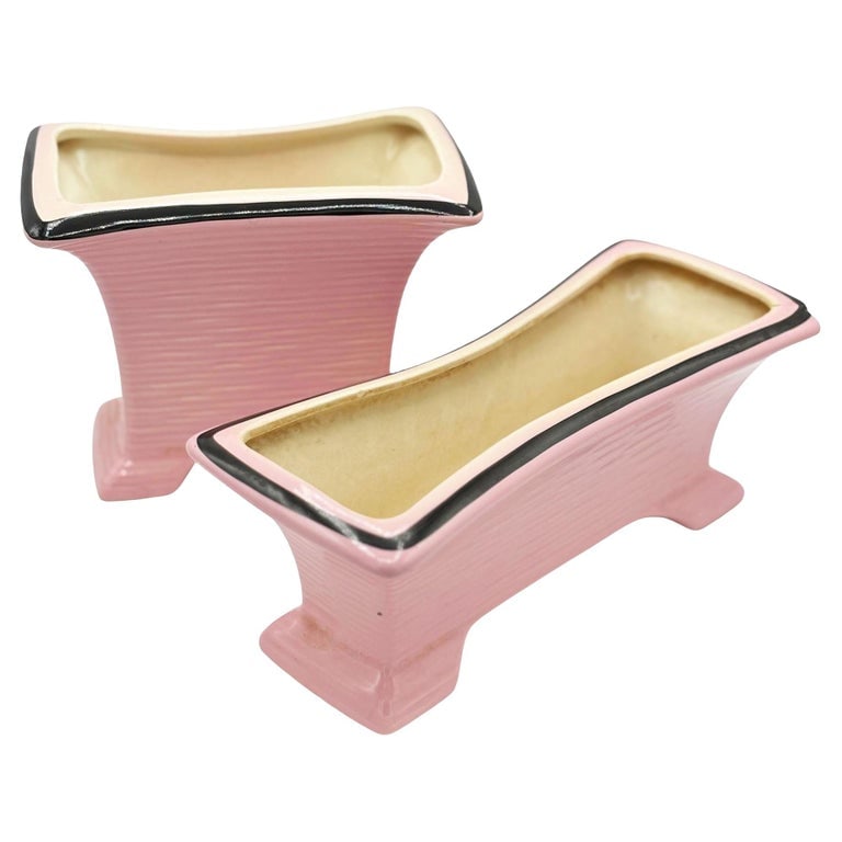 Mid-century Pink & Black California Pottery Modernist Indoor Planter Set: Original 1950s Pink & Black California Pottery Indoor Planter Set with a modernist Googie design. Each planter is crafted from beautiful pink pottery with a unique flared silhouette and elegant black 