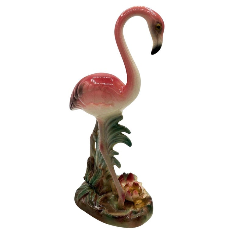 Mid-century Highly Detailed Pink Flamingo Ceramic Tabletop Sculpture Brad Keeler: Mid-century pink and green ceramic flamingo tabletop statue by Brad Keeler. It features a beautifully detailed pink flamingo with highly detailed lush leaves and grass base. The flamingo with a gloss 