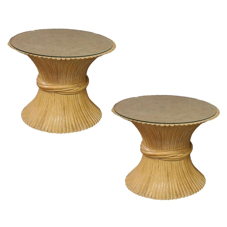 McGuire "Sheaf of Wheat" Stacked Hourglass Rattan End Table, Pair: A pair of rattan side tables by McGuire feature sculptural organic modern hourglass design and glass tops. The McGuire "Sheaf of Wheat" Stacked Rattan End Table is an elegantly Organic Modern design c