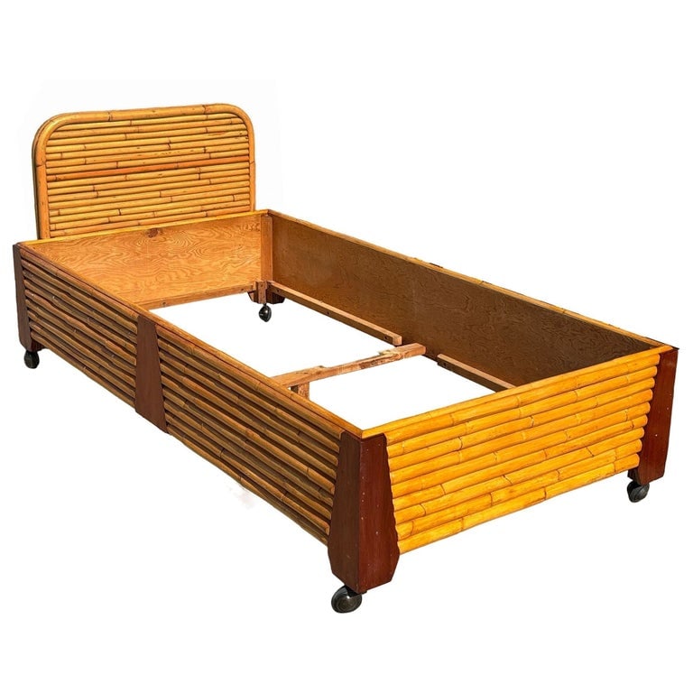 Restored Art Deco Geometric Stacked Rattan and Mahogany Twin Bed Frame: This beautifully restored Paul Frankl-inspired stacked Rattan and Mahogany Corners Twin Bed Frame combines Hawaiian themes with Art Deco Design. The bed frame features vertically stacked rattan panels