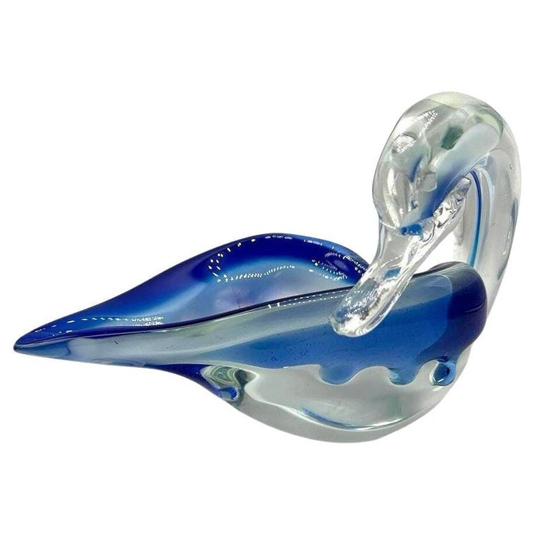 Hand Blown Blue & Transparent Murano Art Glass Swan Ring Tray: Original hand-blown Murano art glass swan dish features a swan with its head resting near its wing. Made from clear glass with blue accents, it combines smooth curves with simple functionality. It's P