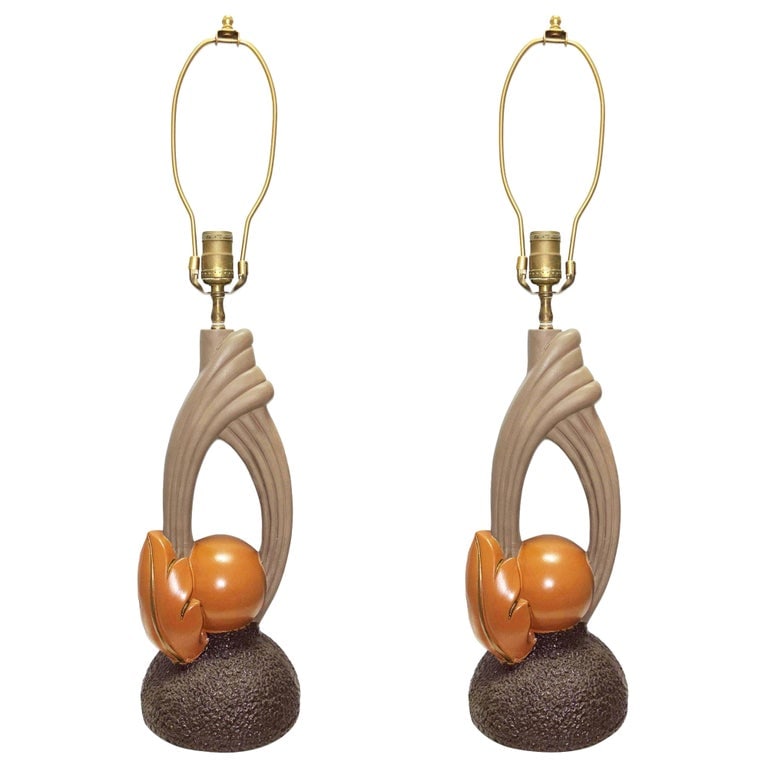 Mid-Century Sculptural Art Pottery Lamp Pair, Circa 1950s: Pair of Mid-Century sculptural art pottery lamps featuring an organic, almost Art Nouveau, floral-inspired form with a modernist Mid-century flair.-PairCirca 1950, unsigned.