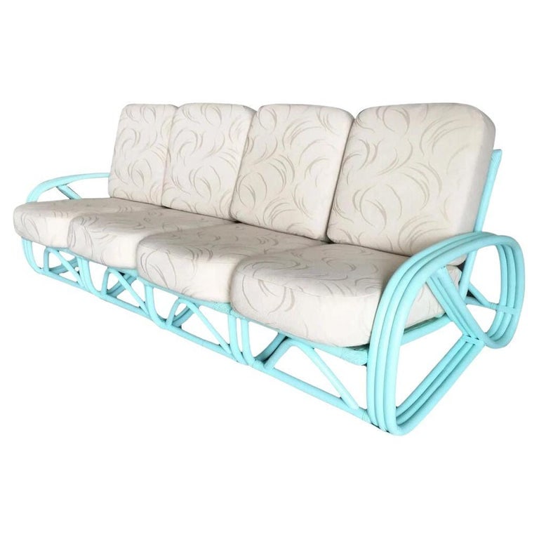 Restored Teal Mid-century 3/4 Pretzel Rattan 4-Seater Sectional Sofa: This beautifully restored Paul Frankl-inspired three-strand 3/4 pretzel arm rattan 4-seat rattan section sofa features a decorative arch along each base finished in a teal color. The sofa is reminisce