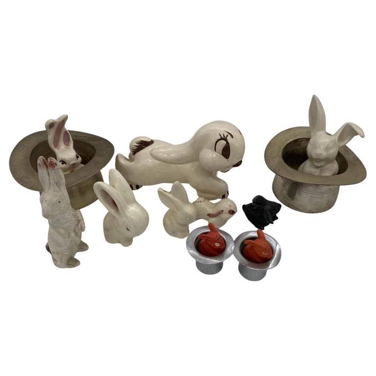 Magician Silver Bunny in a Hat Rabbit Figural Collection: Post War magician bunny in a hat rabbit figurine collection featuring 10 rabbits with 4 metal top hats. The rabbits range from salt shakers to figurines with the largest being 4" tall and the smallest