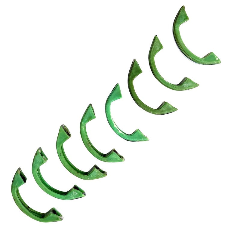 Art Deco Forest Green Bakelite Drawer Pulls w/ Chrome Strip, Set of 8: Set of 8 light forest green bakelite drawer/door pull knobs each with a chrome strip down the center. Complete your period kitchen cabinetry with this classic Art Deco-era piece with a striking blue c