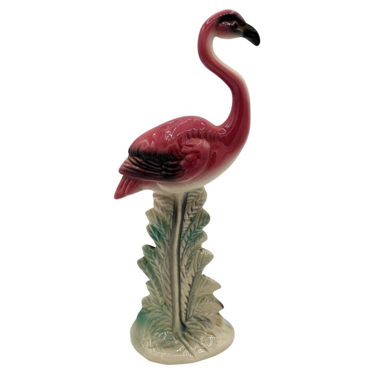 MCM Ceramic California Pottery Standing Tall Pink Flamingo Figurine Statue: Mid-century pink and green long-legged "Standing Tall" flamingo ceramic figurine. The statue detailed a pink flamingo with long legs, a slim, tall form standing proudly on a grassy field. It comes in 
