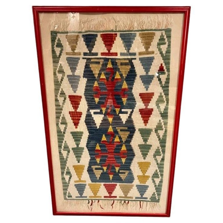 Antique Turkish Anatolian Kilim Rug Framed: Discover timeless elegance with this framed vintage Turkish Anatolian Killim Rug. Crafted from natural wool, its intricate geometric patterns, and vibrant colors add a touch of history and sophisticat