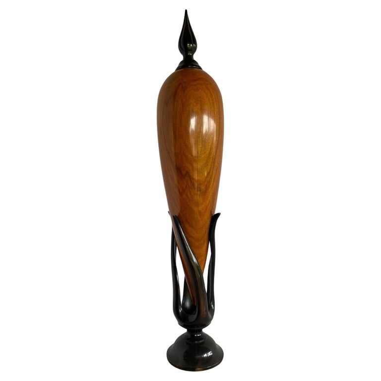 Sculpted Ebony and Chakte Kok Wood "Hollow Vessel" #14 by Don Comer At Lacma Museum: Sculpted Ebony Silver and Chakte Kok Wood #14 "Hollow Vessel" Perfume Bottle by Don ComeSignedThis piece comes was on display at Lacma in 2003.Check our other listings for the companion piece #23