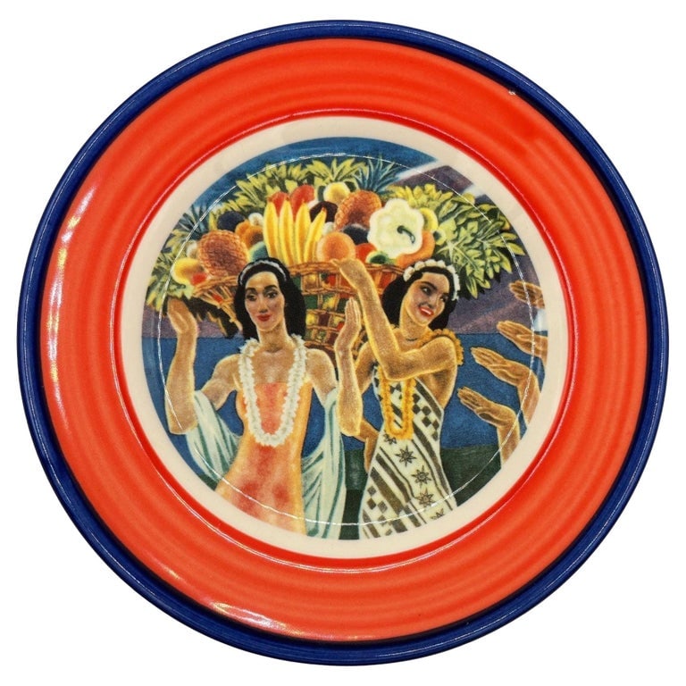 7.25" Eugene Savage "Island Feast" Red Salad Plate By Lynn Krantz Dish Books: Hawaiiana Ware 7.25'' ceramic serving plate featuring the "Island Feast" by artist Eugene Savage, by Homer Laughlin China for Lynn Krantz Dishbooks. The platter features a Red and blue band along the 