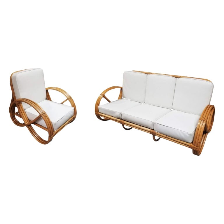 Restored Rattan Three-Strand Full Pretzel Lounge Chair and Three-Seat Sofa Set: This beautifully restored Paul Frankl-inspired living room set featuring a three-strand armchair and a solid piece three-seat sofa with intricate wrappings.Included in the price is a custom choice of 
