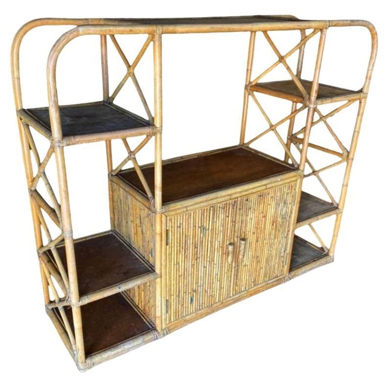 Restored Rattan Seven-Tier Display Shelf Wall Etagere Unit w/ Cabinet: Mid-century Paul Frankl-style seven-level rattan shelf room divider wall with mahogany shelving. The unit features a unique broken-up seven-level shelf design with a two-level cabinet in the center fe