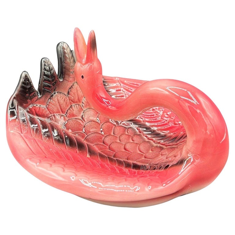 1983 Pink Flamingo Ceramic Ashtray w/ Holder by Sarsaparilla: Mid-century style pink and green ceramic ashtray with a drinking flamingo by Sarsaparilla. The ashtray features a beautifully detailed pink flamingo with its head backwards, forming a cigarette holder
