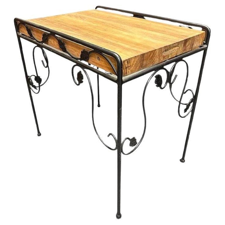 Wrought Iron Scrolling Ivy Wire Patio Wire Side Table w/ Butcher Block Top: Elevate your patio with this striking wrought iron Butcher Block side table. The scrolling iron base showcases graceful curves and intricate ivy detailing, lending a timeless elegance to the piece. At