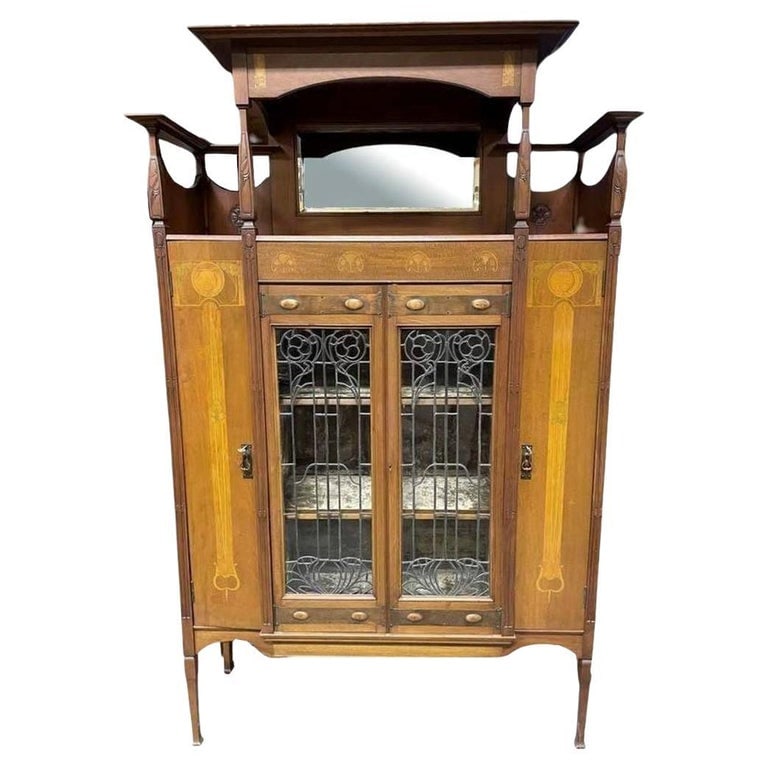 Antique Art Nouveau Mahogany and Floral Marquetry Display Cabinet: This magnificent Art Nouveau light-up display cabinet showcases exquisite Gallé-style marquetry with floral inlays, likely crafted from sycamore and boxwood in soft golden yellow and chartreuse tones