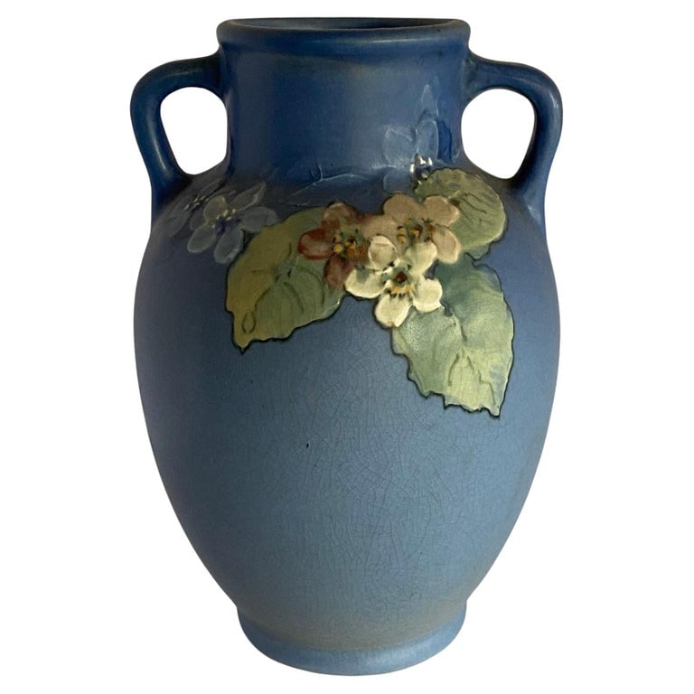 Antique Arts & Crafts Hand-Painted Art Pottery Vase by Weller Pottery: Antique Arts & Crafts art pottery vase by Weller Pottery features pink and white floral design on graduated sea foam green to blue ground, artist and maker signed as photographed, circa 1920.Measures: