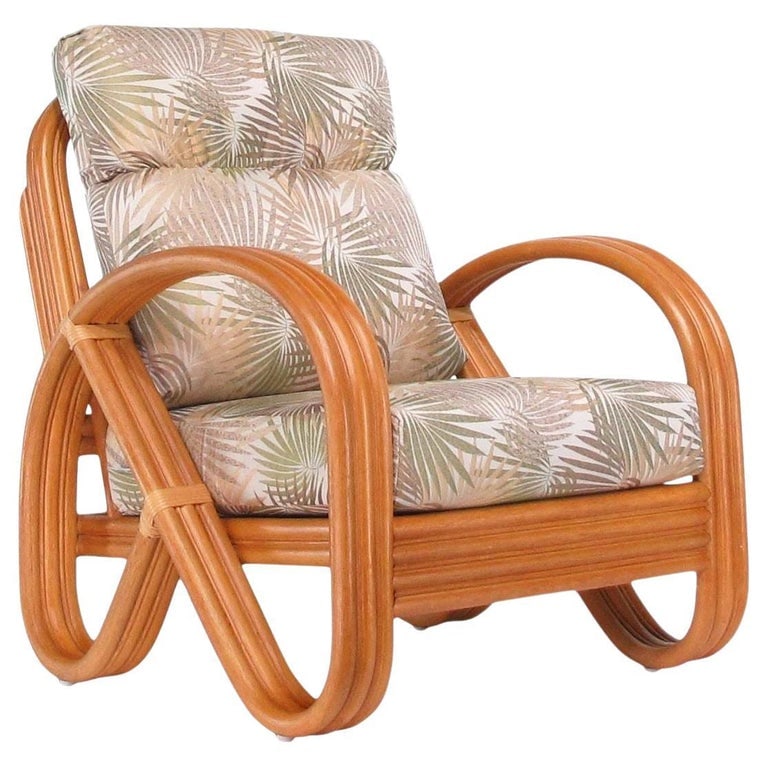 Modernist 3-Strand 3/4 Pretzel "Kauai" Rattan Lounge Chair: New old stock three-strand ¾ rattan "Kauai" Lounge Chair featuring 3/4 pretzel chair arms with slopped back. Add that mid-20th-century Hawaiian charm and timeless tropical vibe to your home wit
