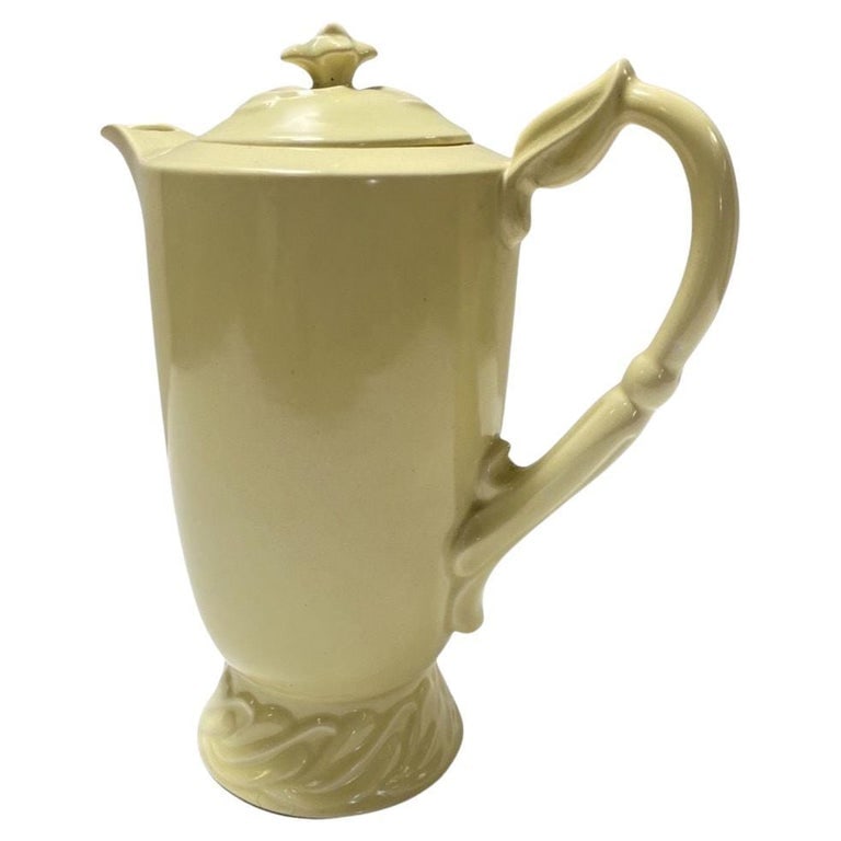 1950's Yellow Vernon Kilns Califonia Ceramic Large Tea Pot: A yellow vintage Vernon Kilns ceramic large teapot is a charming and nostalgic piece that evokes a sense of classic American pottery craftsmanship. Vernon Kilns was a renowned ceramics manufacturer ba