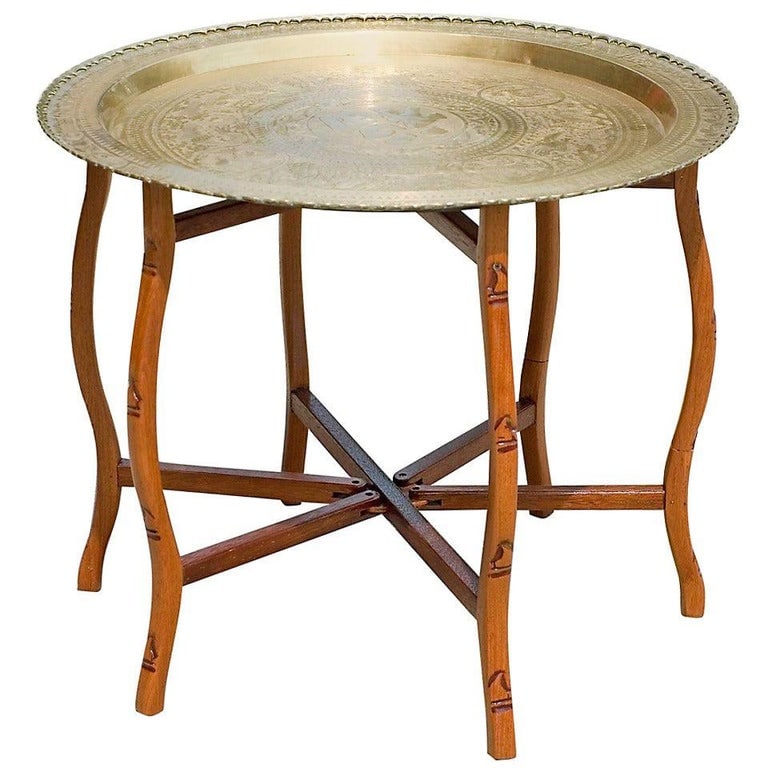 Folding Table with Brass Charger Tray: Fabulous folding table with a scalloped brass charger. The brass charger features beautiful etchings inspired by Eastern Asia with a large Chinese character for "Happiness" in the center. The base fea