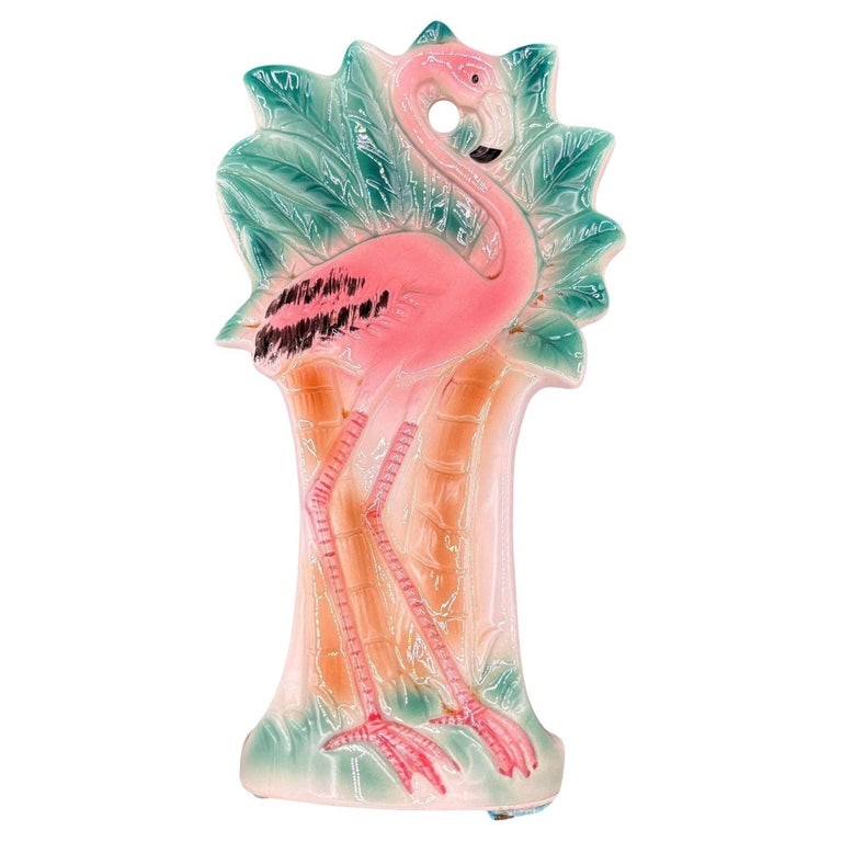1986 Hand Painted Pink Flamingo Ceramic Spoon Rest by Sarsaparilla Deco: Modernist pink and green Flamingo ceramic spoon rest by Sarsaparilla Deco. The spoon rest features a detailed pink flamingo with long legs, a slim, tall form standing on a grassy field with its chest 