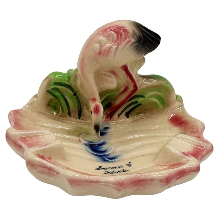 Rare 1948 "Soweru of Florida" Drinking Pink Flamingo Ceramic Ashtray: Mid-century Era pink and green "Soweru of Florida" ceramic ashtray with a drinking flamingo. The ashtray features a beautifully detailed pink flamingo standing on a lush green grassy field and drinkin