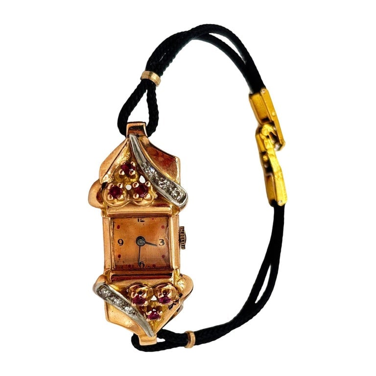 Women's 14K Gold Wristwatch w/ Ruby & Diamond Accents by Jacoby-Bender: An elegant Art Deco ladies’ cocktail wristwatch, crafted in 14K gold with floral ruby and diamond accents. The rectangular case is marked “AR 14K,” indicating solid 14K gold, and features st
