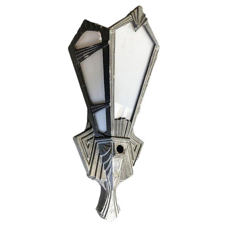 Geometric Art Deco Aluminum Wall Sconce w/ Slat Milk Glass Panels, 4 Available: Original 1920s Art Deco aluminum wall sconces epitomize the era's geometric flair. Adorned with milk plane glass, their design reflects the treads in the movie theaters of classic Hollywood. The combi