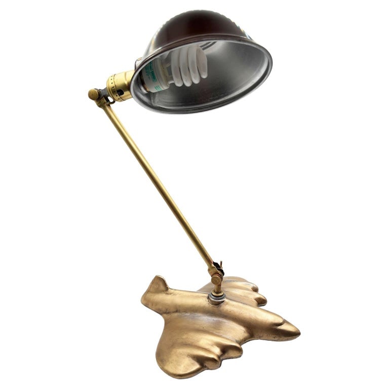 Rare 1987 Brass-tone Art Deco Style DC-3 Airplane Table Lamp, by Sarsaparilla: A rare Art Deco–inspired Sarsaparilla banker’s lamp featuring a sculptural Brass-tone jet-plane base and classic adjustable arm. This striking piece blends aviation nostalgia with mid-century exec