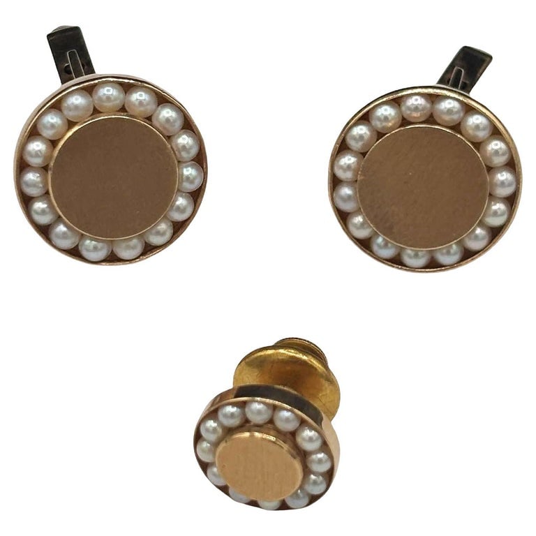 Round 14-Karat Pearl Cufflinks with Bullet Back Clasp and tie Pin: Mid-century era round 14-Karat Gold & Pearl Bullet Back Cufflinks with matching Lapel Pin. Each cufflink features 15 deep-set natural pearls fixedalong the edges. Also includes a matching 10 mm la