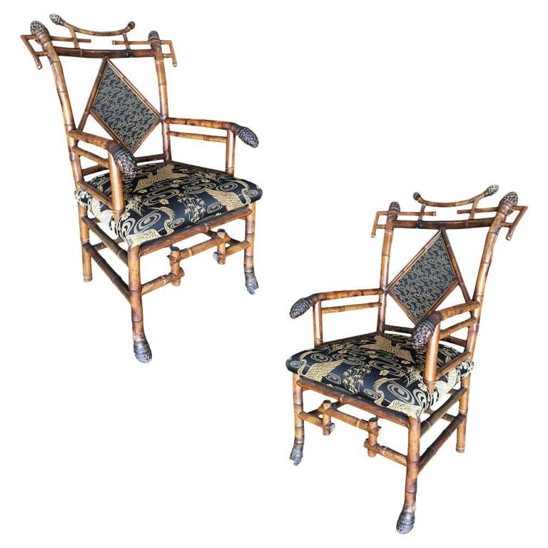 Late Victorian Aesthetic Movement Bamboo Chippendale Salon Chairs, Pair: A stunning pair of late 19th Century Aesthetic Movement bamboo Chippendale Salon chairs. Each features an intricate geometric design and striking black crane embroidered seats. With a regal presence a