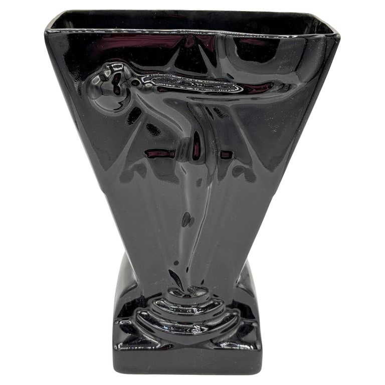 1985 Art Deco Black Pottery Vase Nude Figurine Sculpture Vase by Pelzman Design: 1985 Art Deco style black pottery vase nude figurine sculpture vase by Pelzman Design. The vase features a high gloss finish and features a relief of a nude woman standing on a pedestal, arms stretchi
