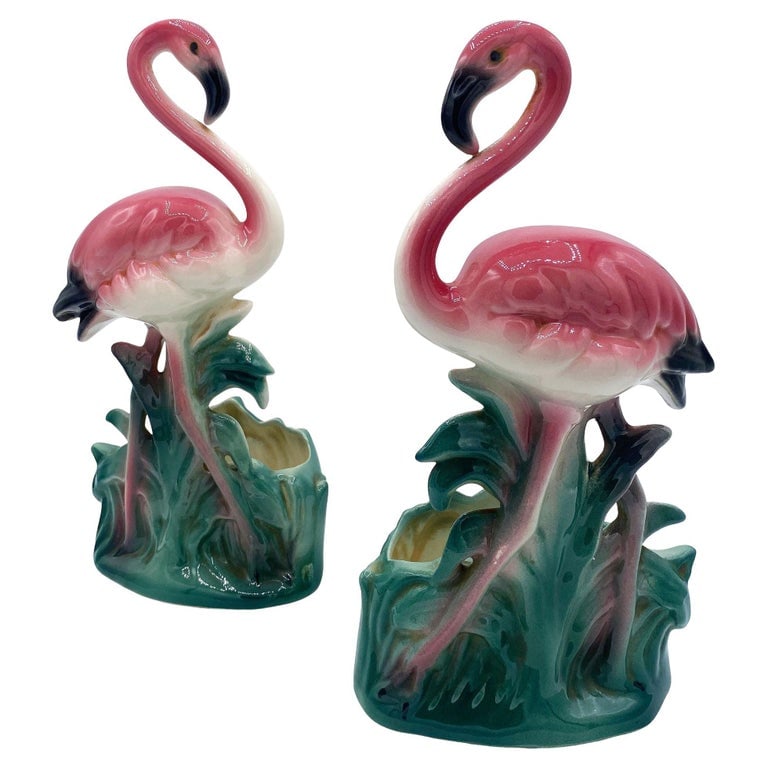 Mid-century "Lovers" Ceramic Pink Flamingo Flower Table Planter Set, California: Mid-century pink and green "Lovers" ceramic flamingo tabletop California planter, matching His and Her set. The set features two beautifully detailed pink flamingos in lush green leaves and grass with