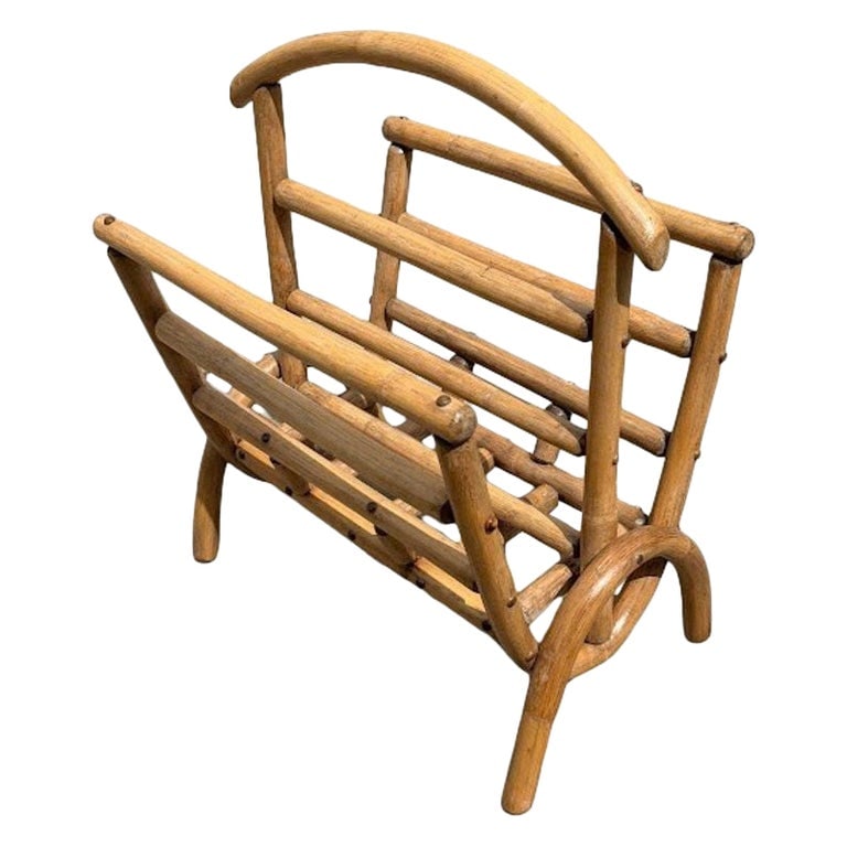 Restored Rattan Magazine or Log Holder: This beautifully restored mid-century rattan holder offers a versatile and stylish storage solution, ideal for magazines, newspapers, or small logs. Handcrafted with steam-bent rattan poles and curved