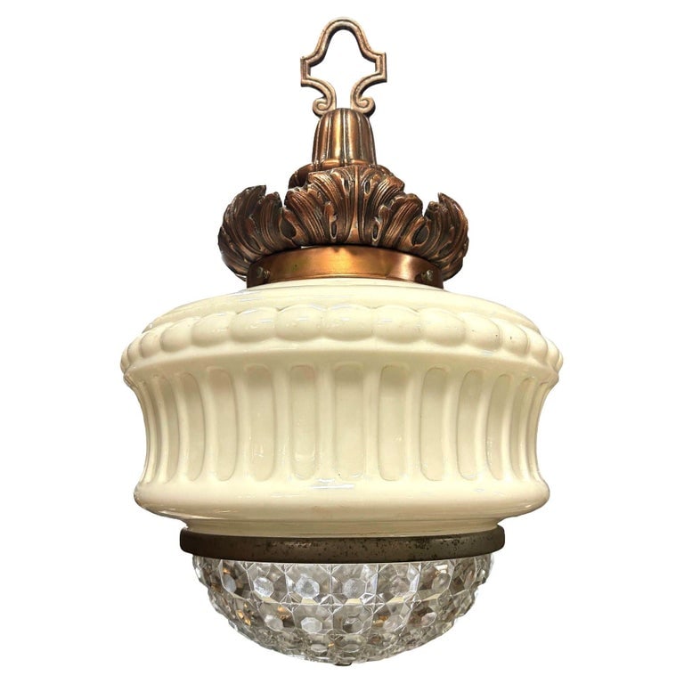 Art Deco Copper Acanthus Leaf Pendant Light w/ Crystal & Milk Glass Acorn Shade: 1930s Art Deco pendant light featuring an acorn-shaped milk glass and crystal shade, and ornate cast brass fitter with a warm copper finish. The crown showcases acanthus leaf detailing, adding a touch