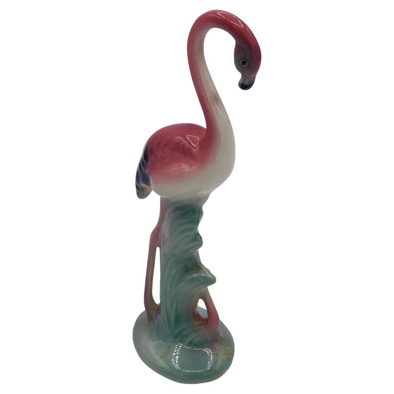 Mid-century Standing Tall Pink Flamingo Ceramic Tabletop Sculpture Brad Keeler: Mid-century pink and green ceramic flamingo tabletop statue by Brad Keeler. It features a beautifully detailed pink flamingo in lush leaves and grass. The flamingo with a gloss finish that highlights 