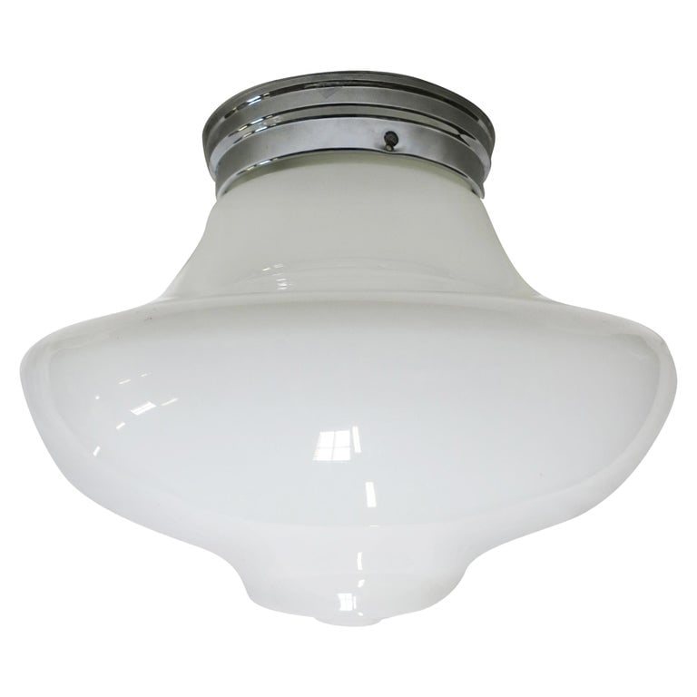 Large Schoolhouse Bell-Shape Ceiling Glass Globe Pendant: Once used everywhere from classrooms, libraries and courthouses alike, schoolhouse globes offered a practical and utilitarian design with solid, hard-working ambient lighting. Our globe features a lar