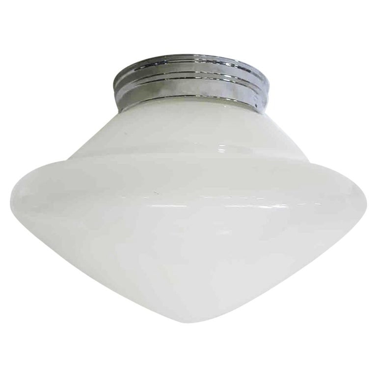 Large Schoolhouse Rounded Cone Shape Ceiling Glass Globe Pendant: Once used everywhere from classrooms, libraries and courthouses alike, schoolhouse globes offered a practical and utilitarian design with solid, hard-working ambient lighting. Our globe features a bel