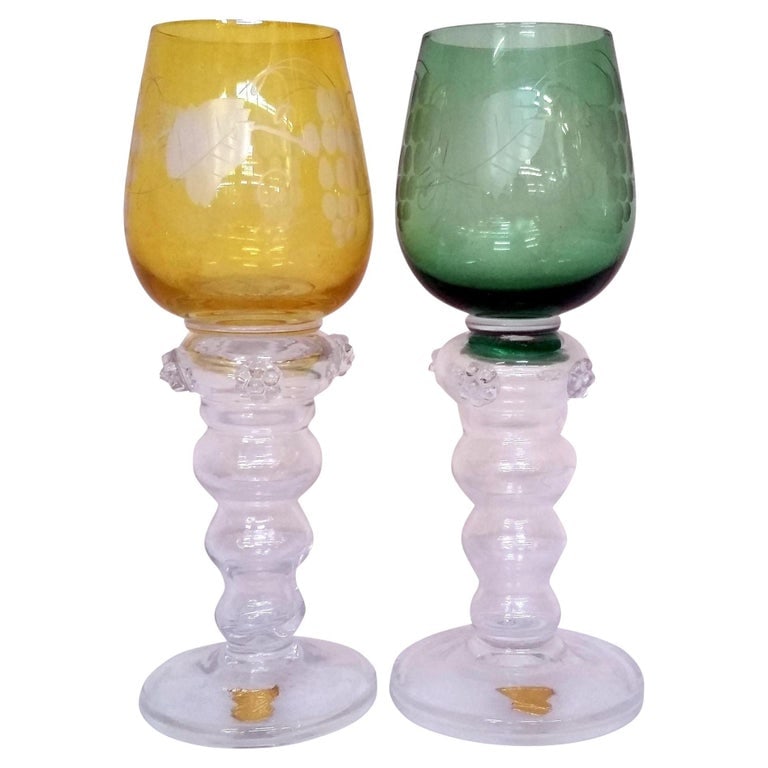 Mid-century Hand-blown Swedish Green & Yellow Wine Goblets by Gullaskruf, Pair: Set of two hand-blown Mid-century wine goblets from the Gullaskruf Glassworks in Sweden. Each goblet features an etched grape and vine design and a transparent stem, with one rendered with a yellow bo