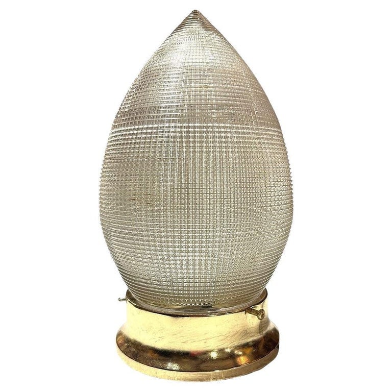 MCM Holophane Teardrop Glass Ceiling Pendant w/ Light Brass Fitter, 2 Avalible: Hollywood Regency style Holophane pendant features a classic teardrop-shaped glass shade that beautifully diffuses light that almost sparkles when lit up. A warm brass fitter complements the textured 