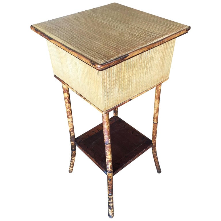 Restored Antique Tiger Bamboo Pedestal with Storage Box: Antique tiger bamboo pedestal side table with rice mat top with flip open lid storage and a secondary bottom shelf.Restored to new for you.All rattan, bamboo and wicker furniture has been painstakingl
