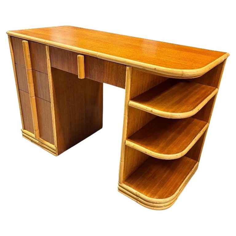 Streamline Mahogany and Rattan Writing Desk with Rattan Pulls & Shelf: Streamline Art Deco rattan writing desk with a rattan border, Mahogany sides, and top with four pull drawers and 3-tier side shelf along the side. Restored to new for you.We only purchase and sell