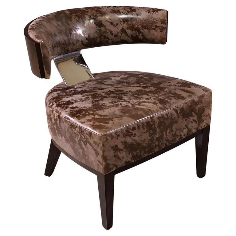 Dakota Jackson "Marina Martini" Lounge Chair: Dakota Jackson "Marina Martini" cherry wood Lounge Chair with sculpted legs and a curved backrest connected to the base with a chromed steel steam with a leather seat.The Marina Collection is inspired